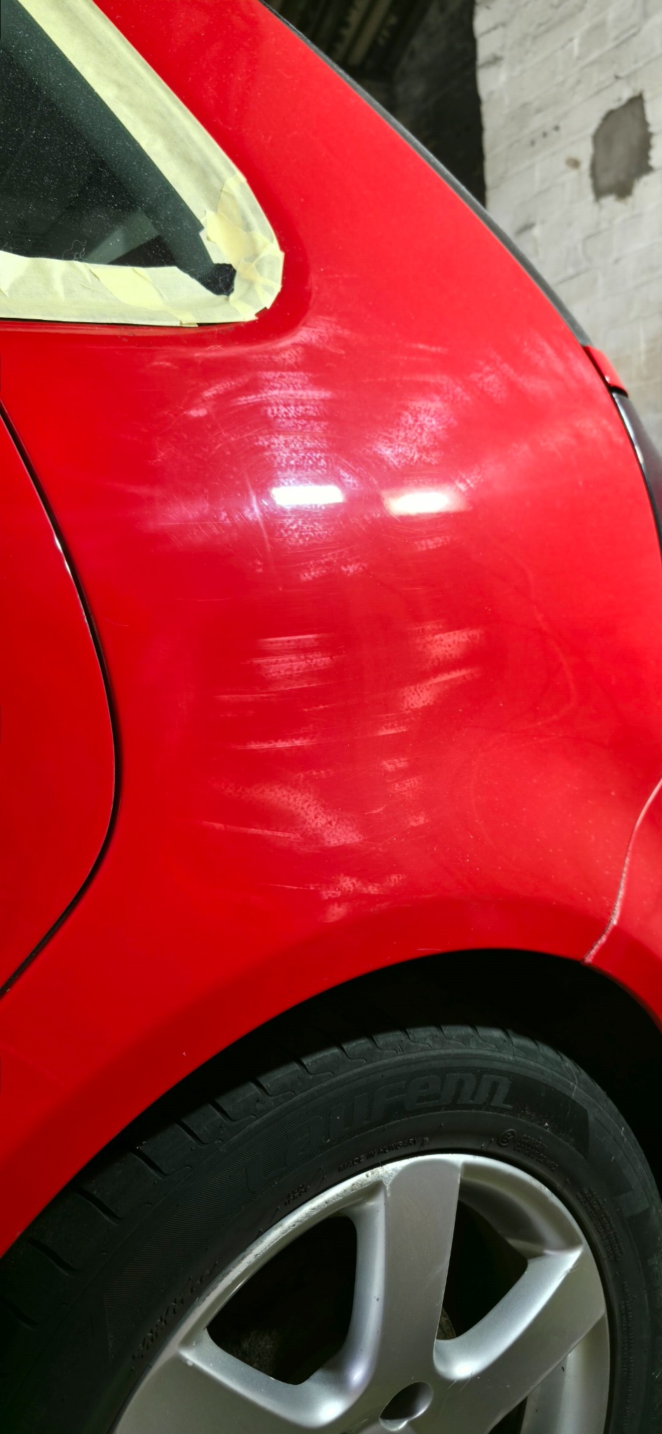 Red paintwork prepared for correction