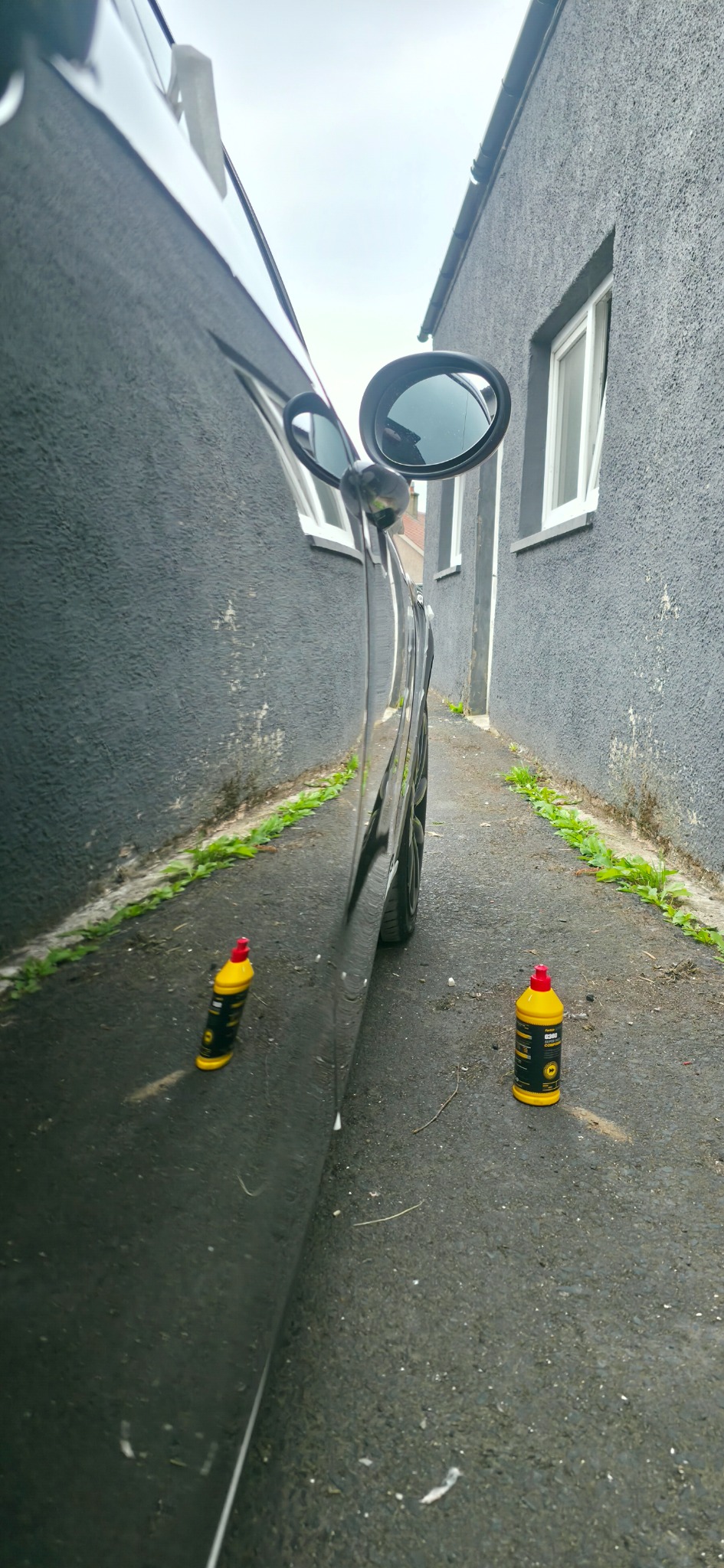 Black paint showing swirl marks before correction